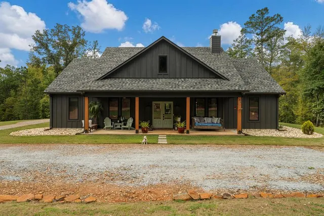 a front view of a house having a yard
