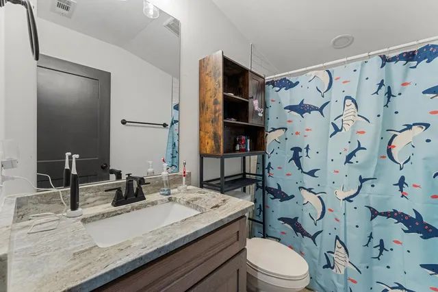 a view of a cars park in front of a room