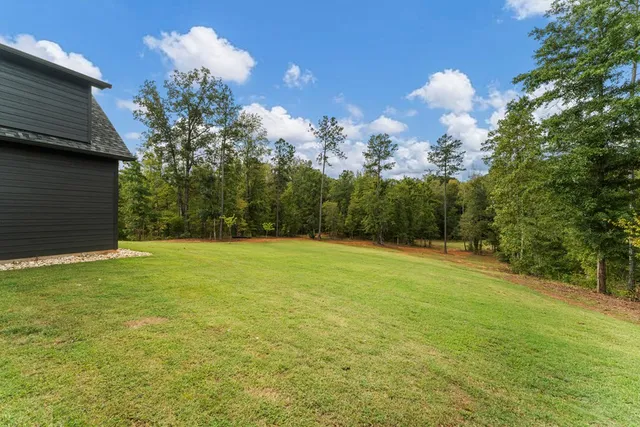 a backyard of a house with entertaining space