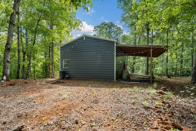 a view of a house with a tree in the background