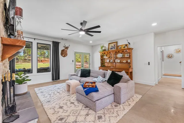 a large kitchen with a table and chairs