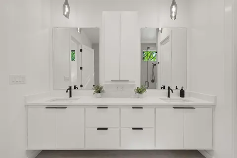 a bathroom with a sink and a mirror