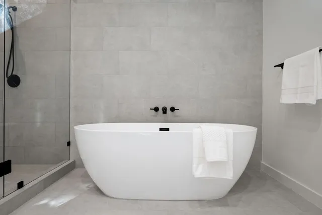 a white bath tub sitting in a bathroom