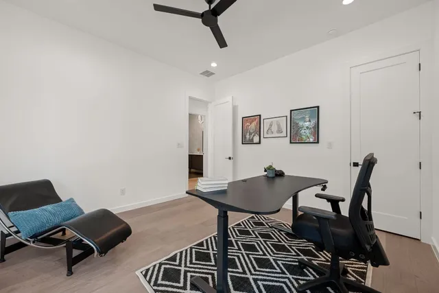 a workspace with furniture and bathroom