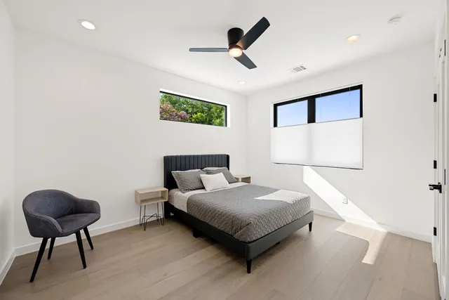 a bedroom with a bed and a chair