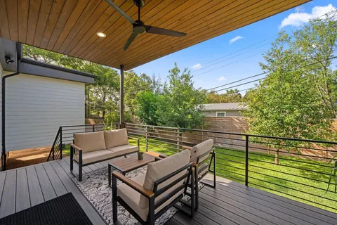 a front view of a house with a garden and porch