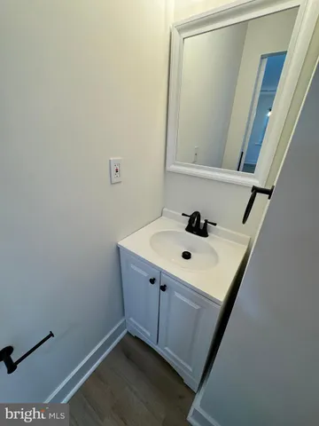 a bathroom with a sink a mirror and vanity