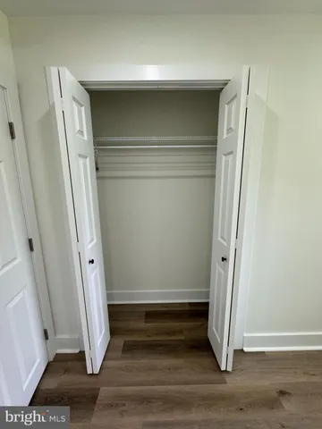 a view of front door and wooden floor