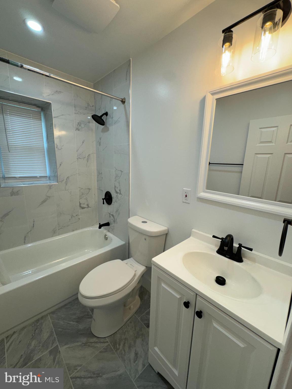 8606 Verree Road Philadelphia, PA 19115 - Photo 34 of 40 a bathroom with a sink a toilet and shower