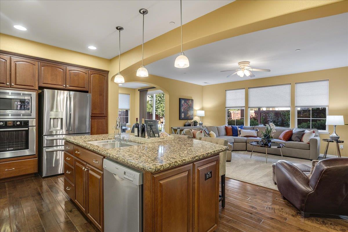 7626 Braid Court Gilroy, CA 95020 - Photo 19 of 49 a kitchen with stainless steel appliances granite countertop a lot of counter space