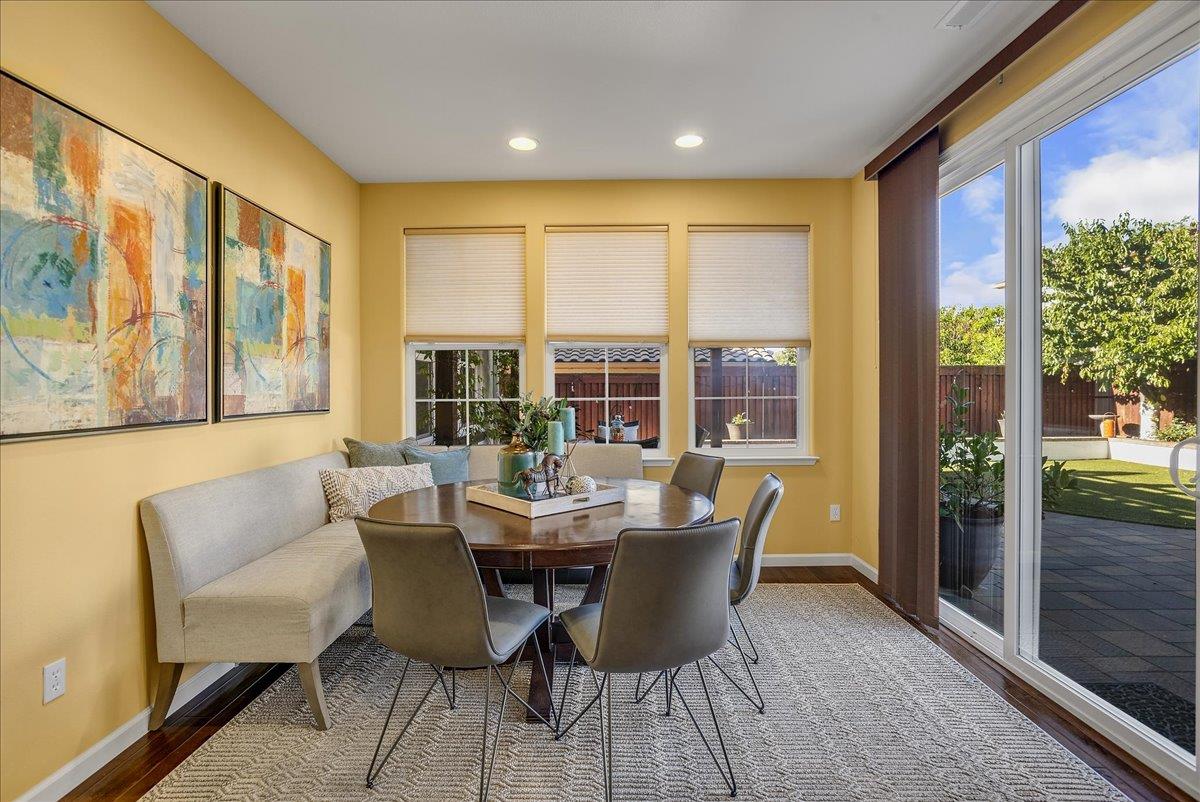 7626 Braid Court Gilroy, CA 95020 - Photo 23 of 49 a view of a dining room with furniture large windows and wooden floor
