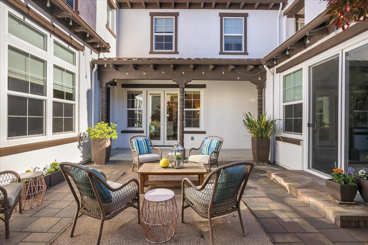 7626 Braid Court Gilroy, CA 95020 - Photo 4 of 49 a view of a patio with table and chairs and potted plants