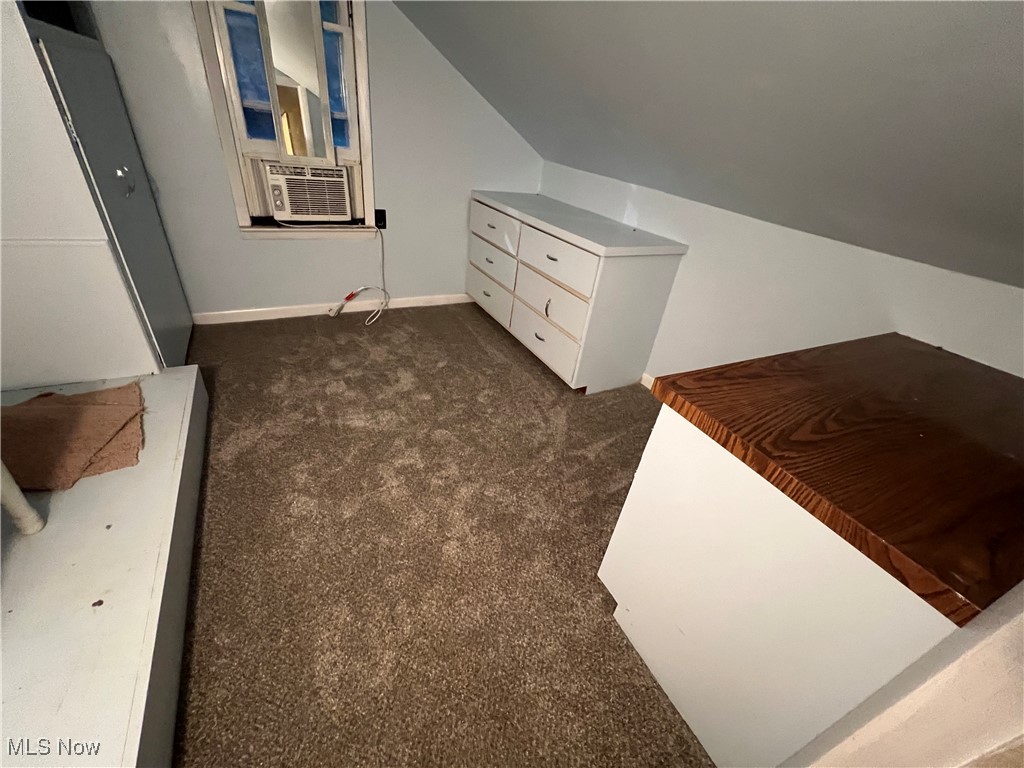 280 Holly Road Northwest Dellroy, OH 44620 - Photo 19 of 26 Carpeted bedroom featuring cooling unit and vaulted ceiling