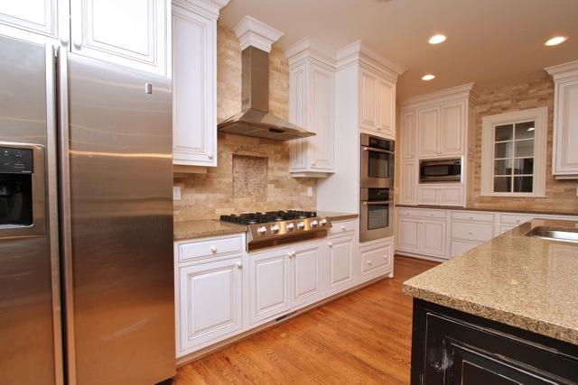 4014 Estes Road Nashville, TN 37215 - Photo 3 of 20 The kitchen features a lots of prep space on the expansive granite counters, custom tile backsplash and top of the line stainless appliances including a double oven and 6 burner gas range.