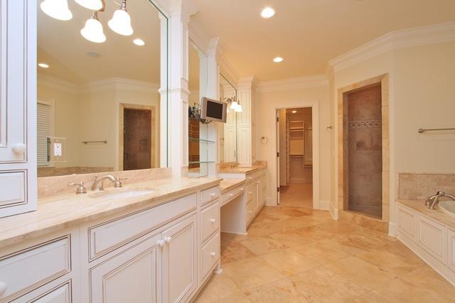 4014 Estes Road Nashville, TN 37215 - Photo 8 of 20 The master bathroom features a large double vanity with make-up area, whirlpool tub and separate travertine tile shower.