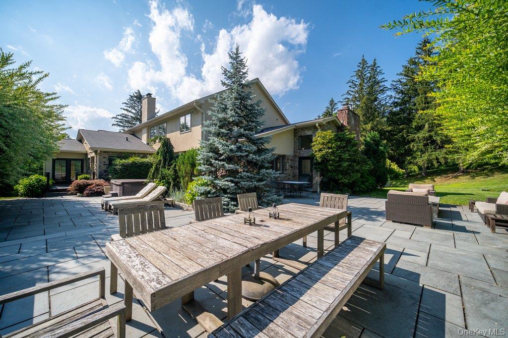 237 Mineral Springs Road Highland Mills, NY 10930 - Photo 6 of 32 View of patio featuring outdoor dining area, outdoor lounge area, and a hot tub