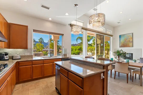 a kitchen with a sink stove and table