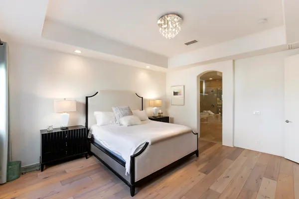 a bedroom with a bed and a table