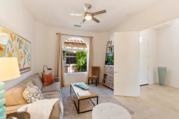 a living room with furniture and a window