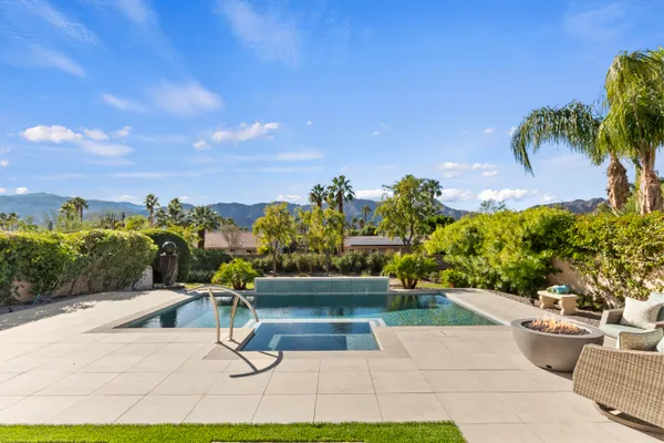 a view of a swimming pool with a patio