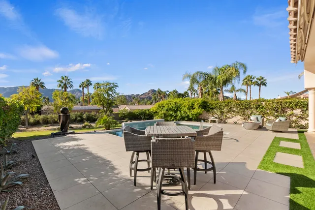 a view of a swimming pool with a patio