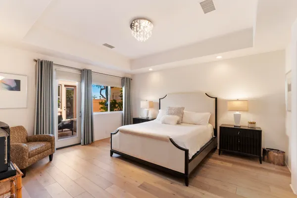 a bedroom with a bed and a couch