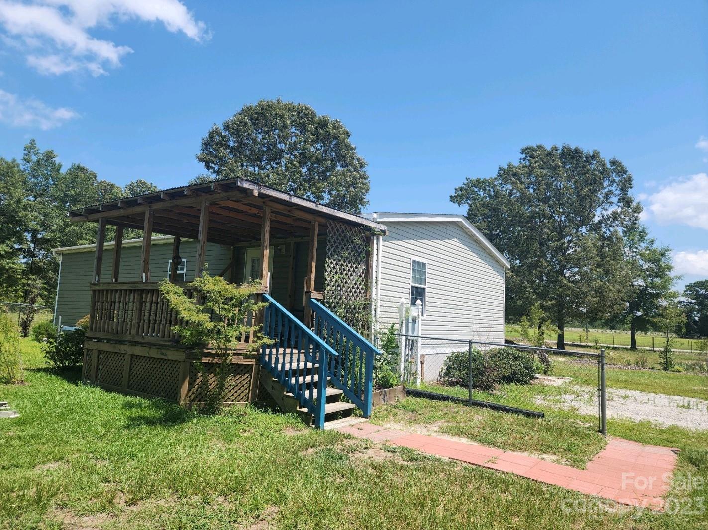 626 Union School Road McBee, SC 29101 - Photo 3 of 19 a view of house with a yard and sitting area