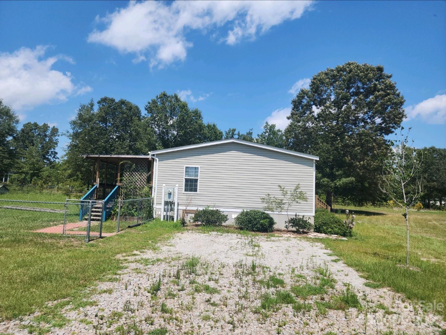 626 Union School Road McBee, SC 29101 - Photo 4 of 19 a view of backyard with deck and garden