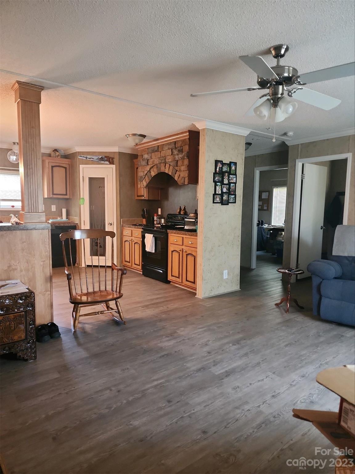 626 Union School Road McBee, SC 29101 - Photo 10 of 19 a view of a livingroom with furniture and a ceiling fan