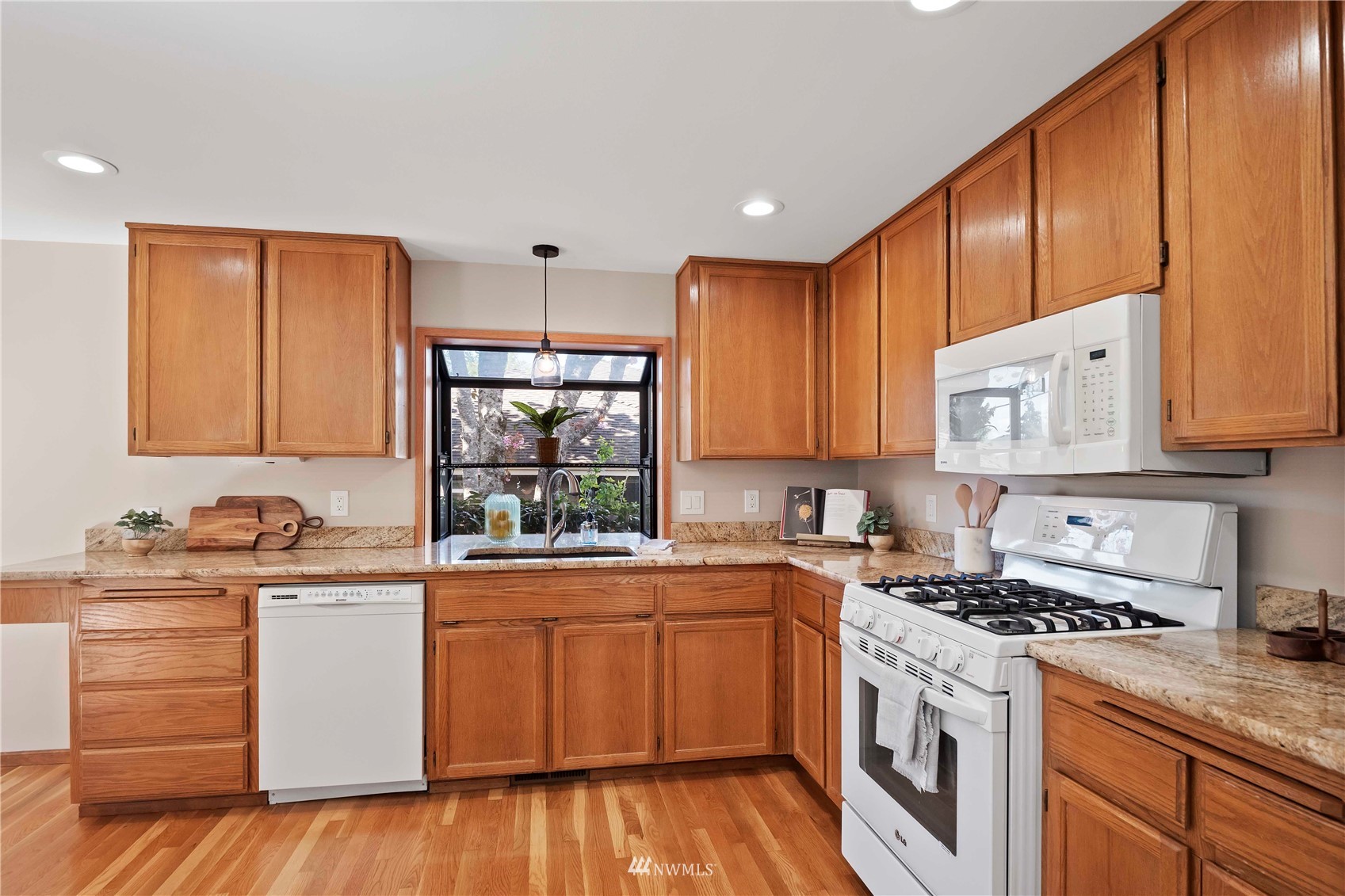 23906 23rd Drive Southeast Bothell, WA 98021 - Photo 11 of 25 a kitchen with a sink a stove and cabinets
