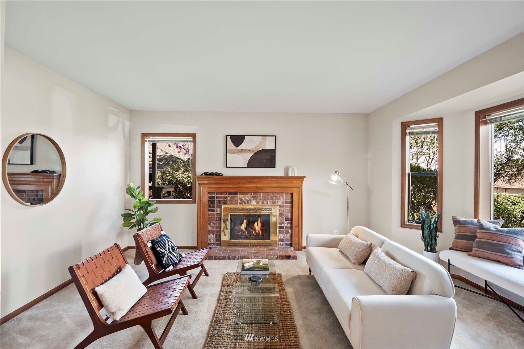 23906 23rd Drive Southeast Bothell, WA 98021 - Photo 2 of 25 a living room with furniture and a fireplace