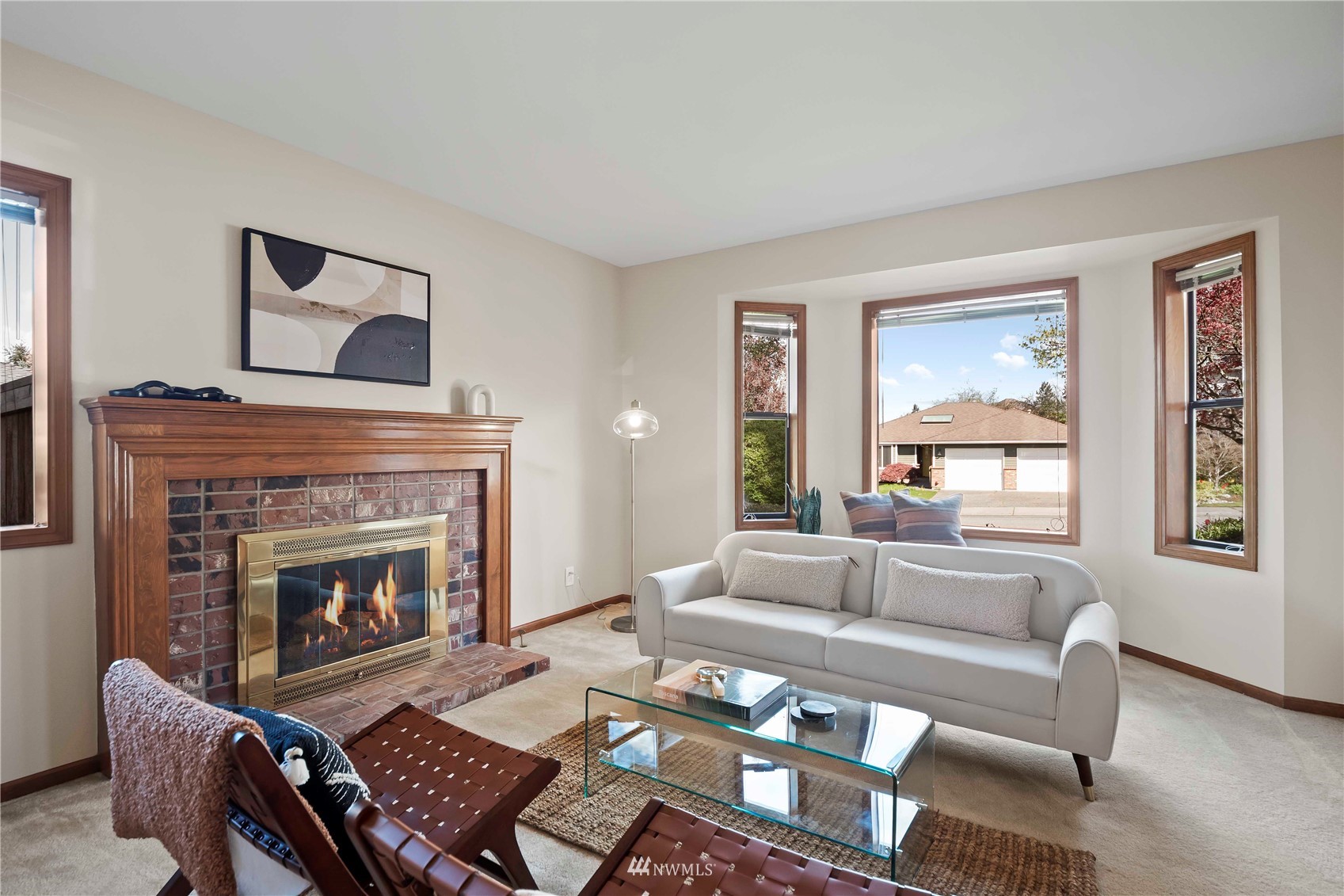 23906 23rd Drive Southeast Bothell, WA 98021 - Photo 3 of 25 a living room with furniture and a fireplace