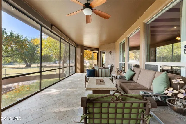 a view of a swimming pool with a patio and a yard
