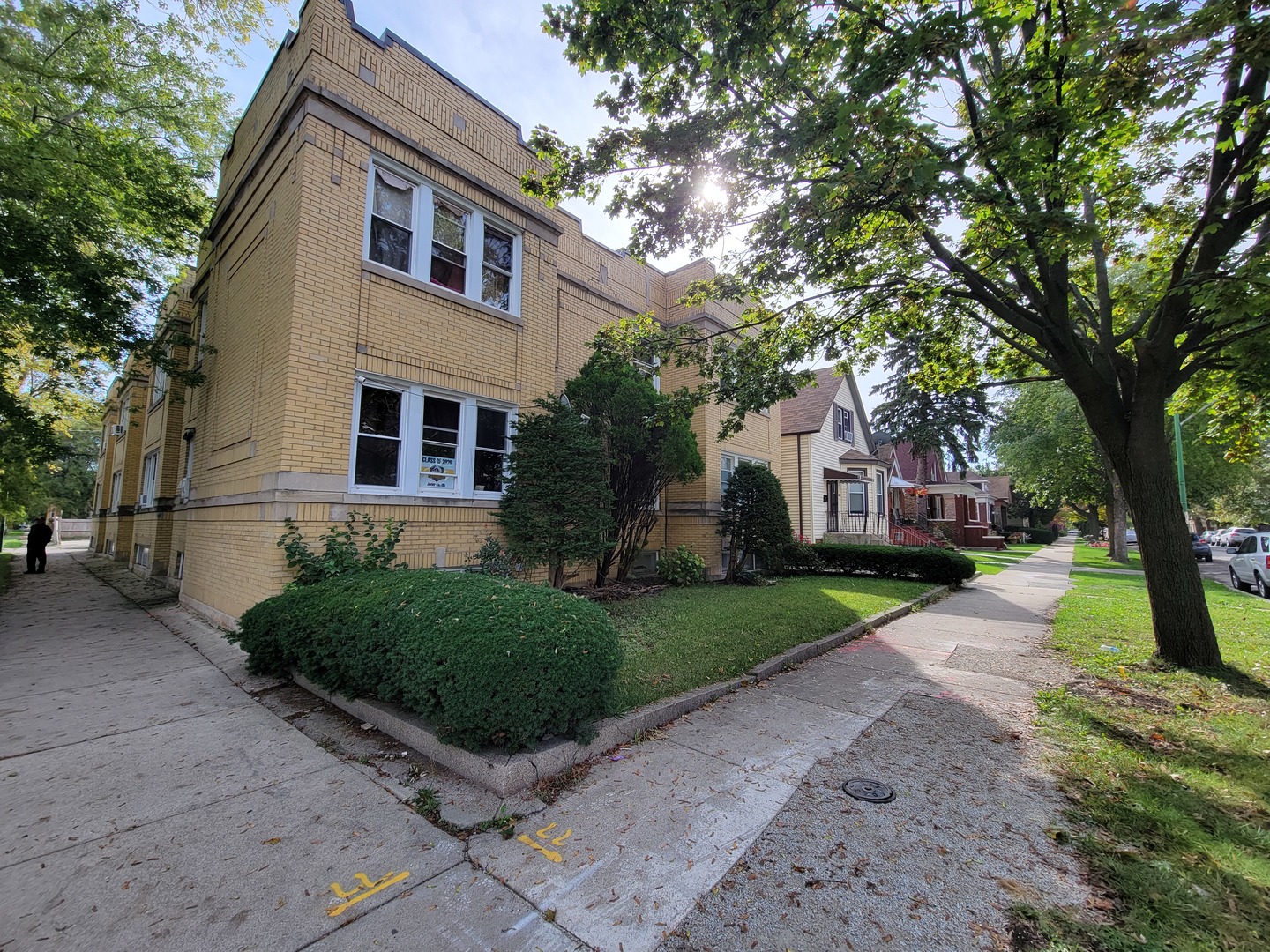 6601 South Troy Street Chicago, IL 60629 - Photo 2 of 5 a front view of a house with a yard and trees