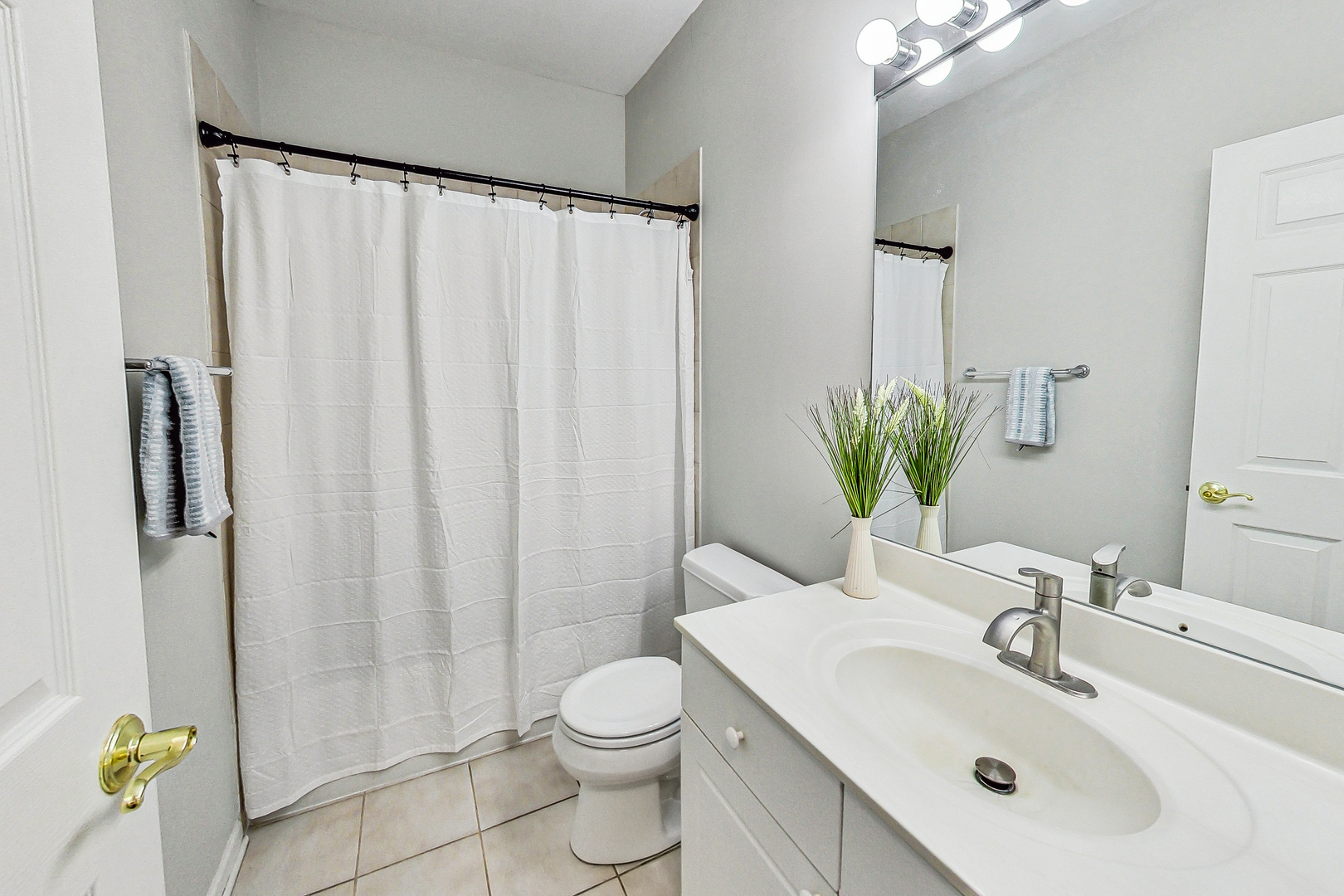 660 McHenry Road, Unit 1102 Wheeling, IL 60090 - Photo 14 of 19 a bathroom with a sink a toilet and shower