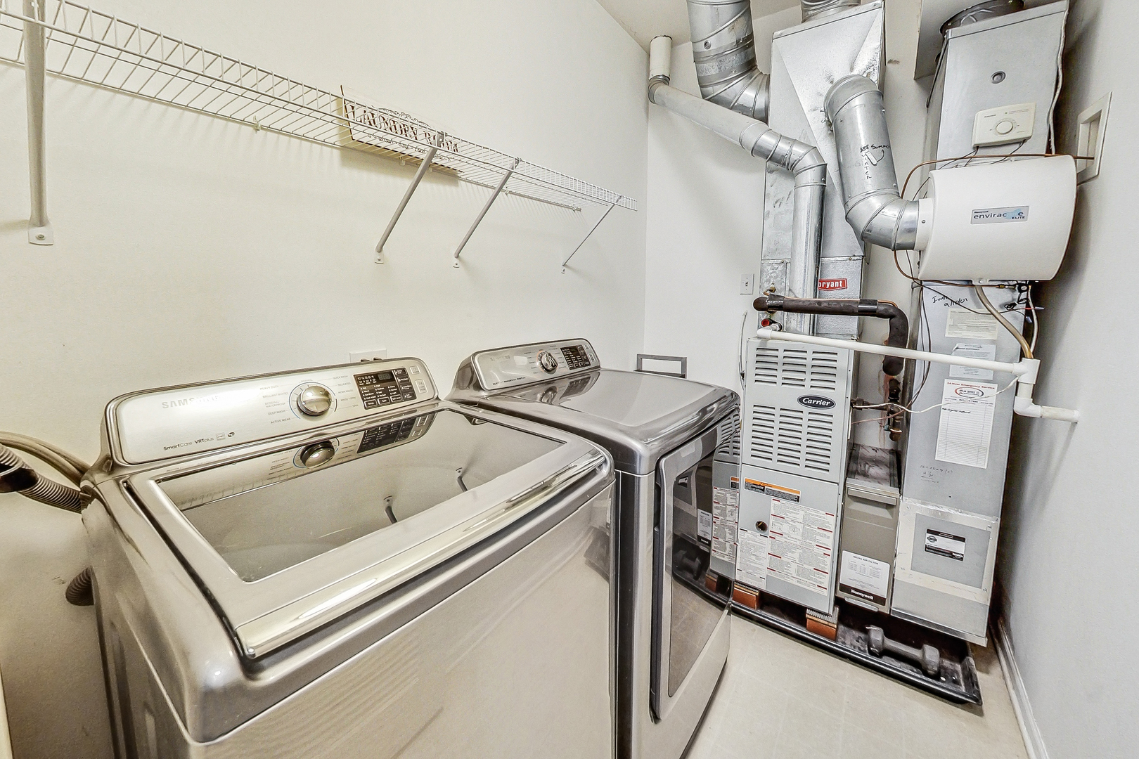 660 McHenry Road, Unit 1102 Wheeling, IL 60090 - Photo 15 of 19 a utility room with dryer and washer