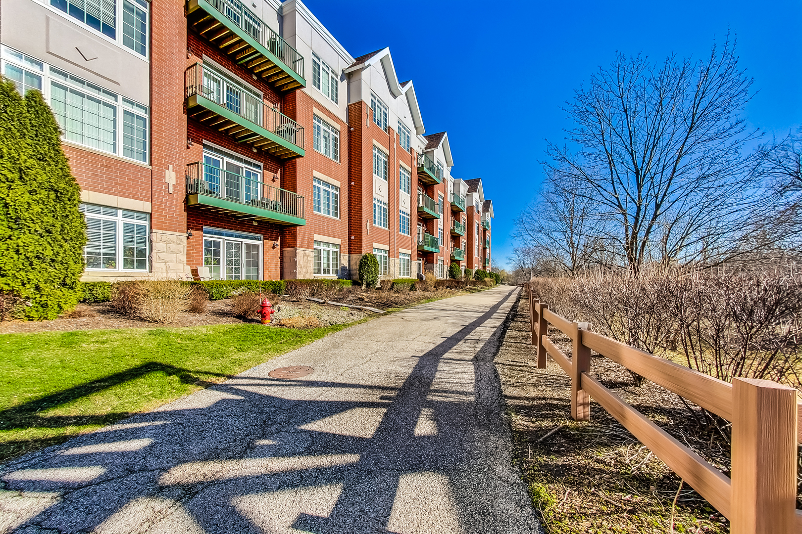 660 McHenry Road, Unit 1102 Wheeling, IL 60090 - Photo 17 of 19 a view of a building with backyard