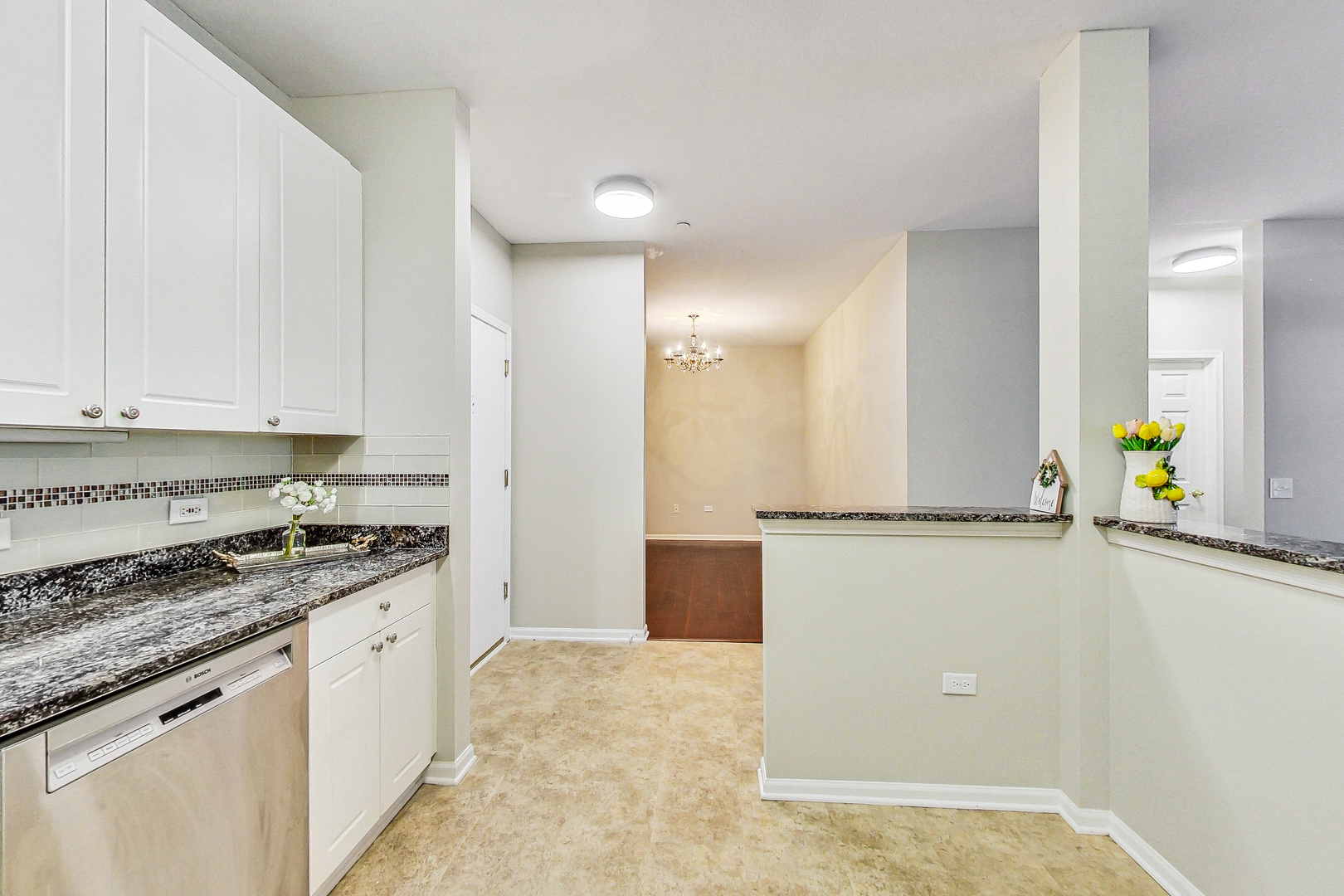 660 McHenry Road, Unit 1102 Wheeling, IL 60090 - Photo 6 of 19 a kitchen with a stove a refrigerator a sink and a stove