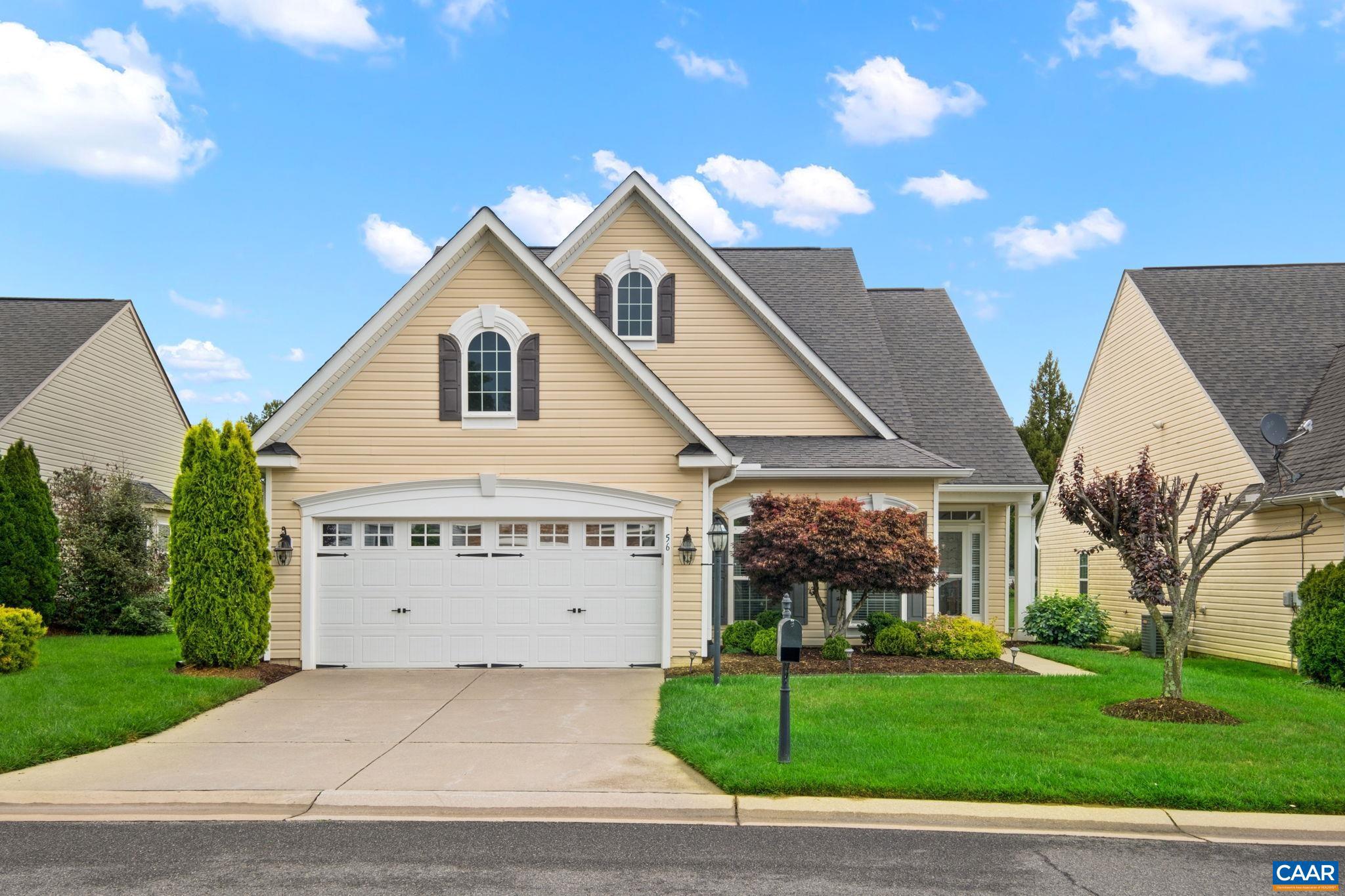 56 John Rucker Drive Ruckersville, VA 22968 - Photo 1 of 38 a front view of a house with a garden and yard