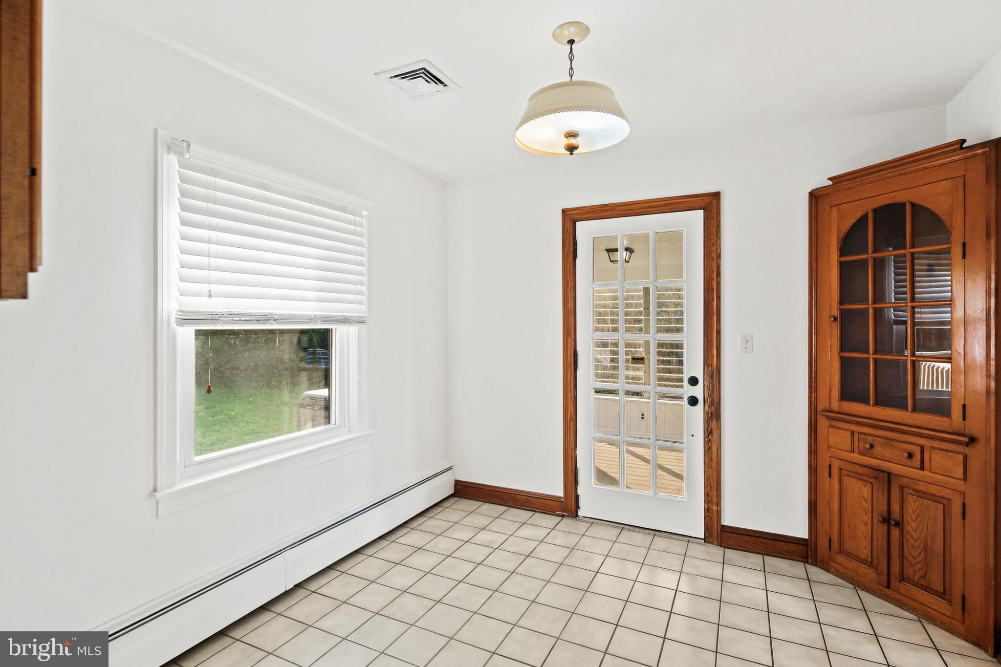 4763 Linthicum Road Dayton, MD 21036 - Photo 12 of 39 Dining room with access to sunroom