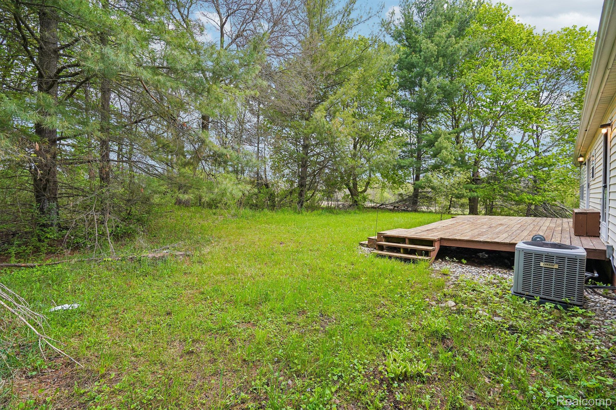 3363 North Branch Road North Branch, MI 48461 - Photo 38 of 38 View of grassy yard with a deck