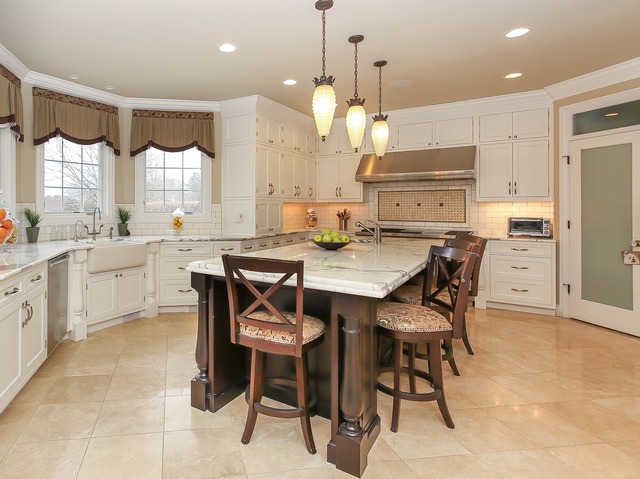 Undisclosed Address Long Grove, IL 60047 - Photo 11 of 25 a large kitchen with a table and chairs in it
