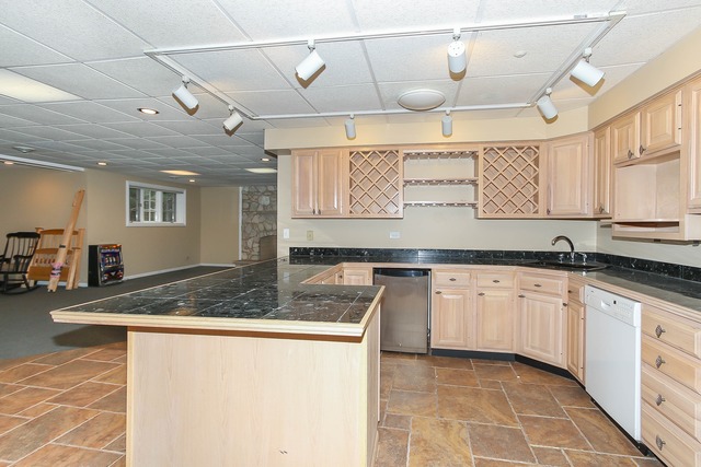 Undisclosed Address Long Grove, IL 60047 - Photo 23 of 25 a kitchen with stainless steel appliances granite countertop a sink and cabinets