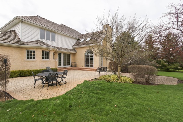 Undisclosed Address Long Grove, IL 60047 - Photo 24 of 25 a backyard of a house with table and chairs