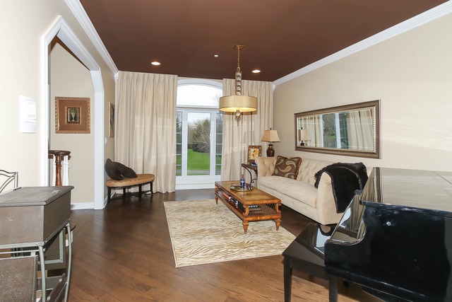 Undisclosed Address Long Grove, IL 60047 - Photo 4 of 25 a living room with furniture and a fireplace