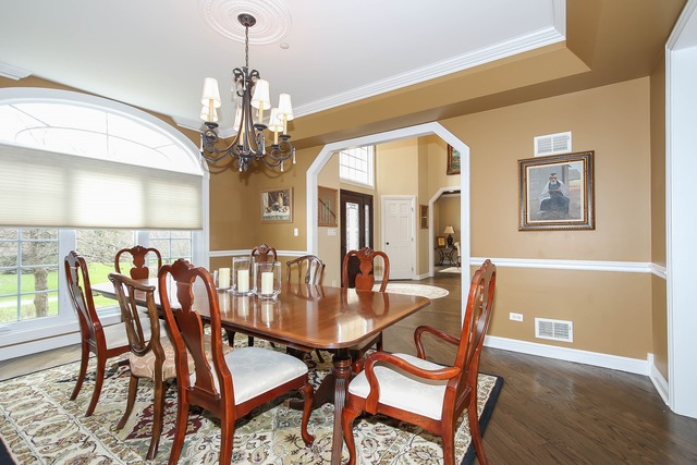 Undisclosed Address Long Grove, IL 60047 - Photo 6 of 25 a view of a dining room with furniture and chandelier