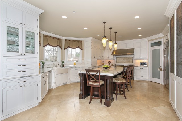 Undisclosed Address Long Grove, IL 60047 - Photo 7 of 25 a kitchen with kitchen island granite countertop lots of white furniture appliances and dining table