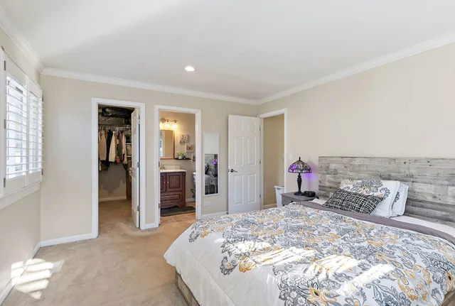 a bed room with a bed and a television