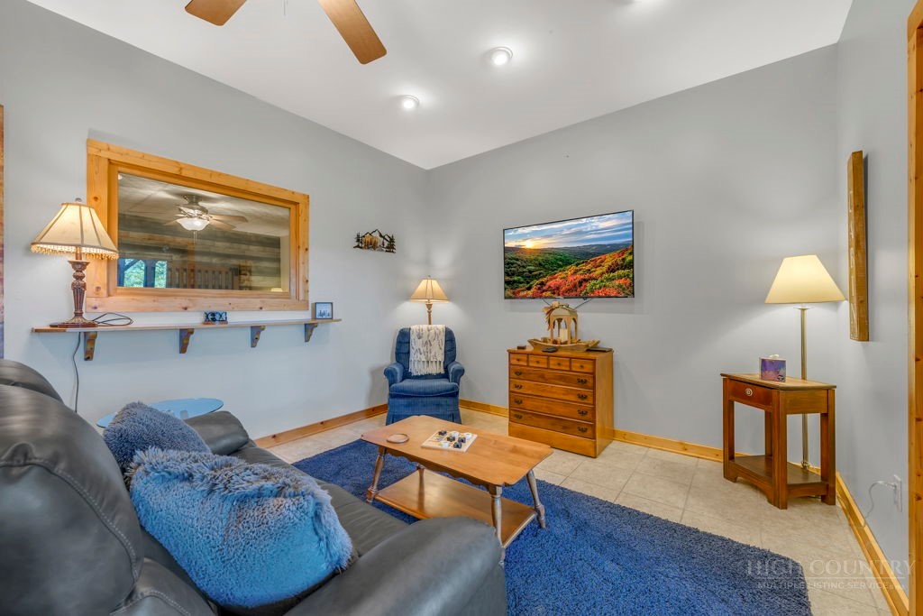 2229 Elk Ridge Road Ferguson, NC 28624 - Photo 33 of 42 a living room with furniture and wooden floor
