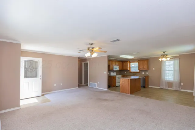 a view of a kitchen with granite countertop cabinets and stainless steel appliances